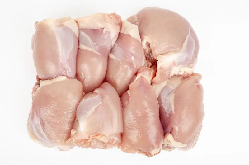 Raw boneless skinless chicken thigh fillets — premium Brazilian poultry